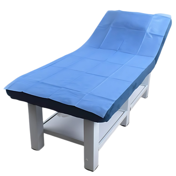 40 GSM blue non-woven disposable medical couch sheet on an examination couch.