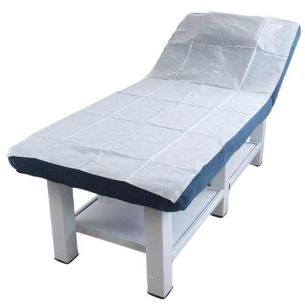 40 GSM white non-woven disposable medical couch sheet on an examination couch.