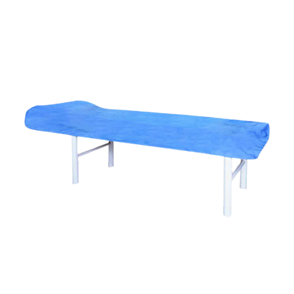 Blue non-woven disposable fitted couch sheet on massage table for spa and wellness use.